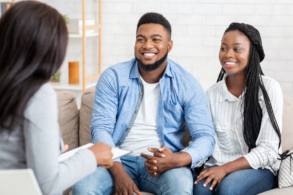 Portrait Of Happy African American Couple After Successful Marital Therapy Session