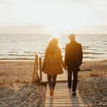 Midlife couple walking on beach